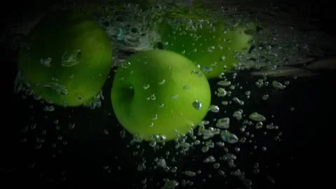 Apples fall into the water. Stock Footage 165140437