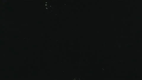 Apples falling into water in slow motion on black background. Stock Footage 171543475