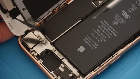 Apple's iPhone 8 opened for repair and fixing service Stock Footage 106260733