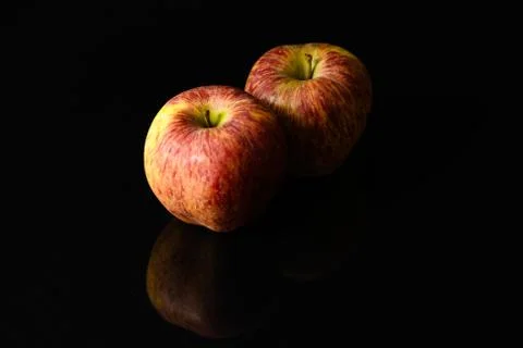 Apples on isolated black background Stock Photos