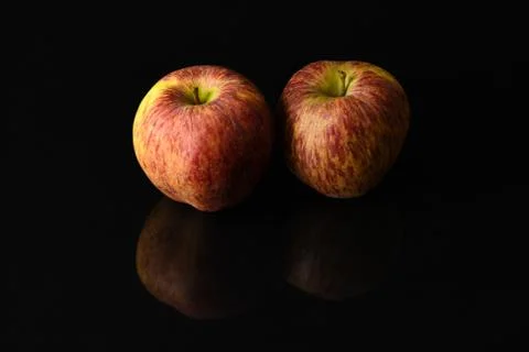 Apples on isolated black background Stock Photos