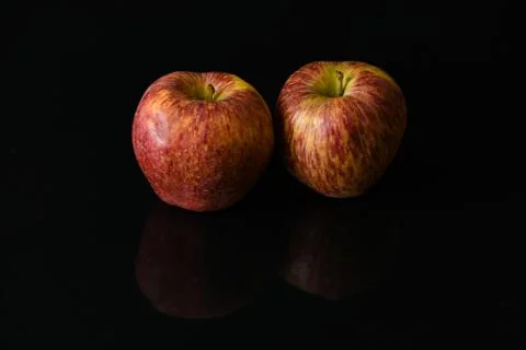 Apples on isolated black background Stock Photos