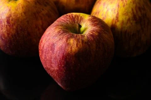 Apples on isolated black background Stock Photos