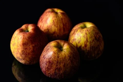 Apples on isolated black background Stock Photos
