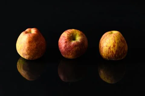 Apples on isolated black background Stock Photos