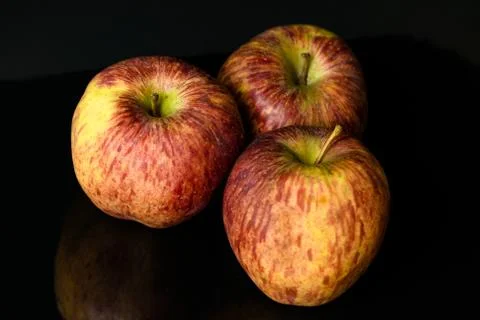 Apples on isolated black background Stock Photos
