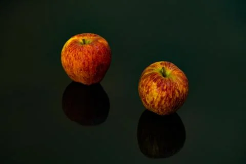 Apples on isolated black background Stock Photos