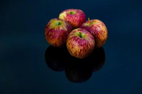 Apples on isolated black background Stock Photos