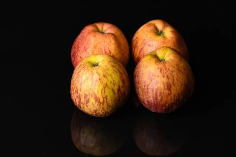 Apples on isolated black background Stock Photos