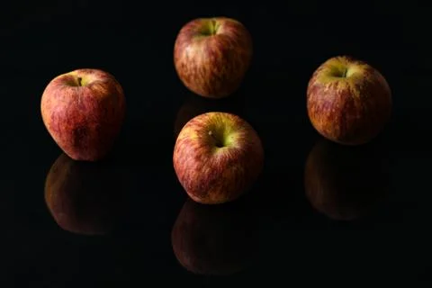 Apples on isolated black background Stock Photos