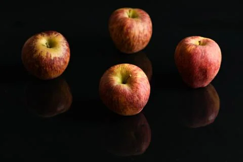 Apples on isolated black background Stock Photos