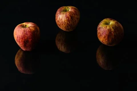 Apples on isolated black background Stock Photos
