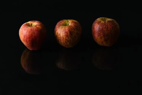 Apples on isolated black background Stock Photos