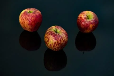 Apples on isolated black background Stock Photos