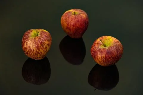 Apples on isolated black background Stock Photos
