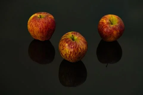 Apples on isolated black background Stock Photos