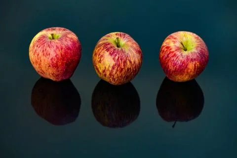 Apples on isolated black background Stock Photos