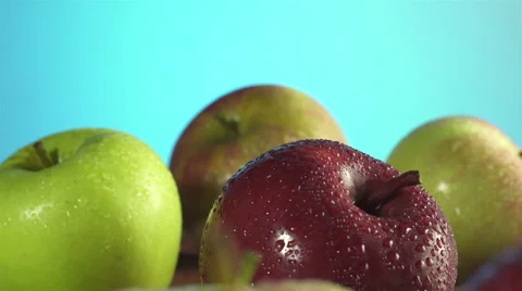 Apples isolated rotating on blue/indigo background Video stock 62344172