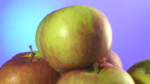 Apples isolated rotating on blue/purple background Stock Footage 62393680