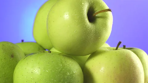 Apples isolated rotating on blue/purple background Video stock 62414530