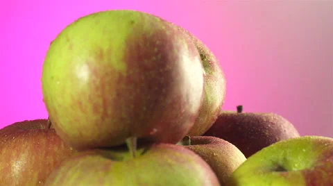 Apples isolated rotating on pink background Video stock 62393648