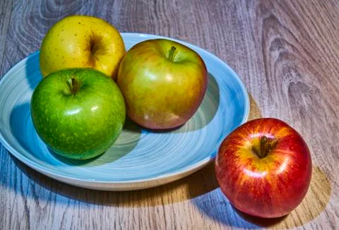 Apples on plate and table 写真素材