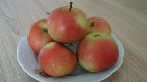 Apples on a plate Stock Photos