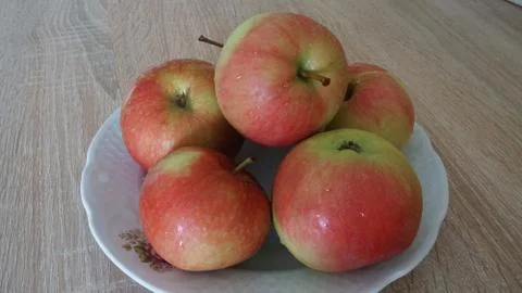Apples on a plate Stock Photos