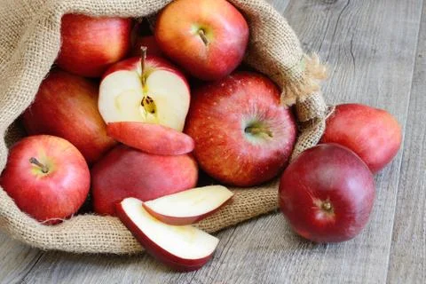 Apples in sack Stock Photos