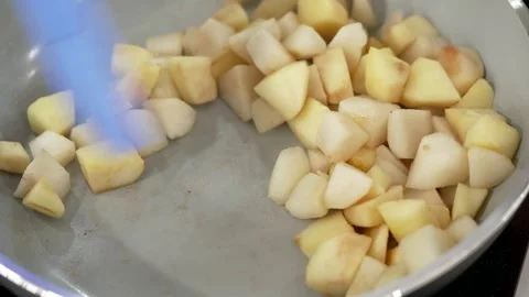 Apples sautéed in a pan to make jam Stock Footage 293494147