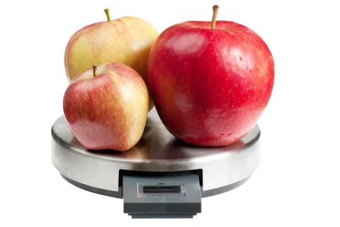 Apples on a scales Stock Photos