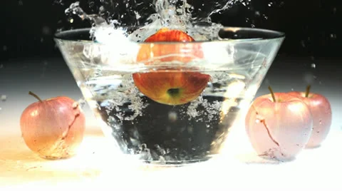 Apples splashing in slow motion Stock-Footage 24735555