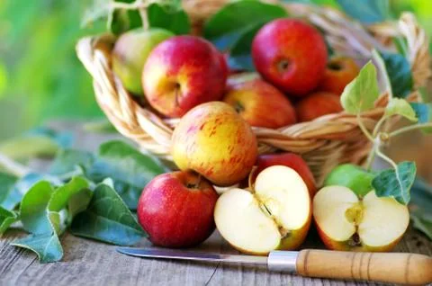 Apples on table and knife Stock Photos