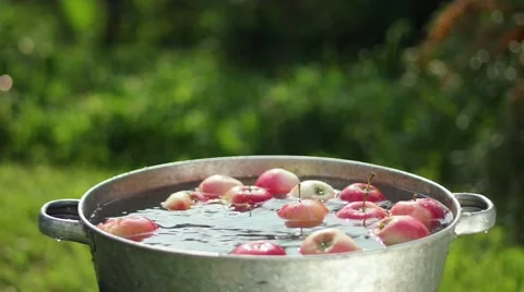 Apples in water. Apples are washed in a basin of water Stock Footage