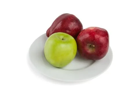 Apples on a white plate Stock Photos