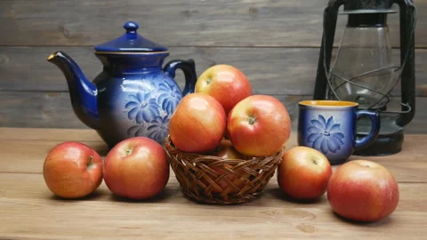 Apples on a wooden table. Camera slowly turns around the fruit. Stock Footage 106725422