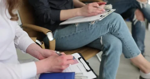 Applicants for getting Visa sit in queue in embassy office Stock Footage 246371401