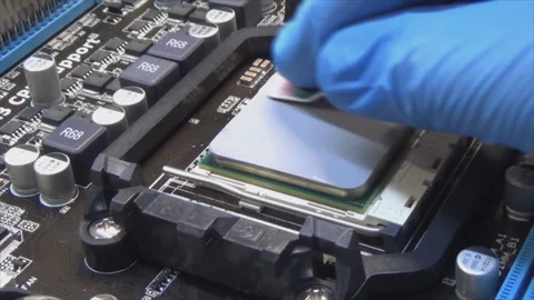 Application and distribution of thermal paste from a tube to the main processor Video stock 143691721