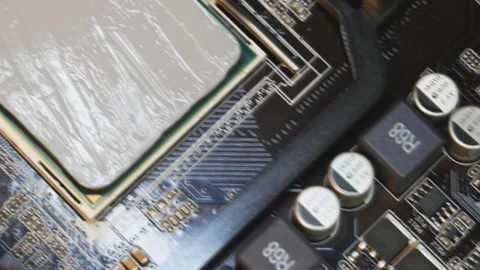 Application and distribution of thermal paste from a tube to the main processor Stock Footage 146407428