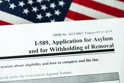Application for asylum to USA concept with application form and USA flag Stock Photos
