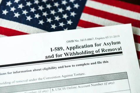 Application for asylum to USA concept with application form and USA flag Stock Photos