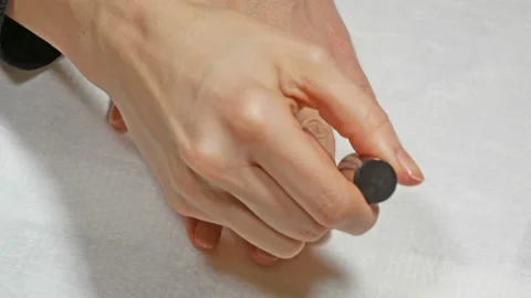 Application of base to the nails of the left hand Video stock 106461153