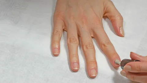 Application of base to the nails of the right hand Video stock 108169656