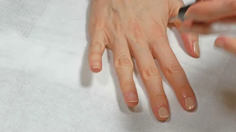 Application of base to the nails of the right hand Stock Footage 108169950