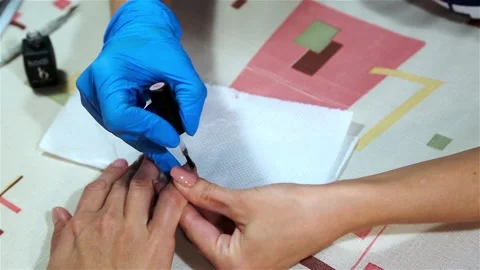Application of clear varnish on nails Stock Footage 90410898