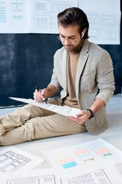 Application Developer Sitting On Floor Stock Photos