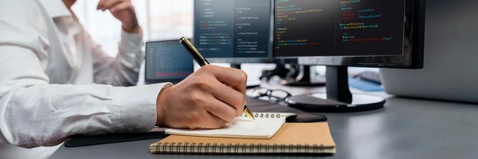 Application developer solving and writing code. Trailblazing Stock Photos