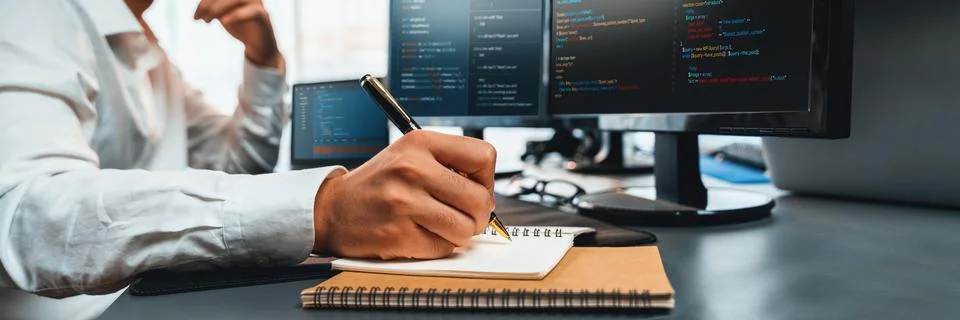 Application developer solving and writing code. Trailblazing Stock Photos