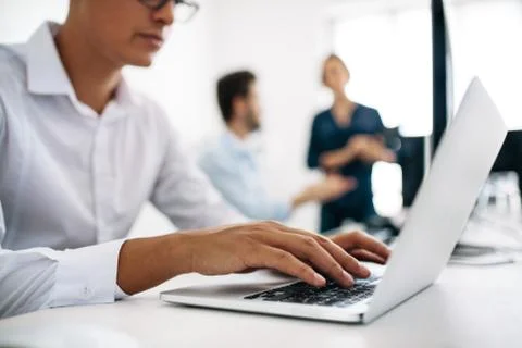 Application developers working on computers in office 写真素材