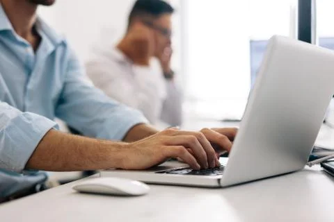 Application developers working on computers in office Stock Photos